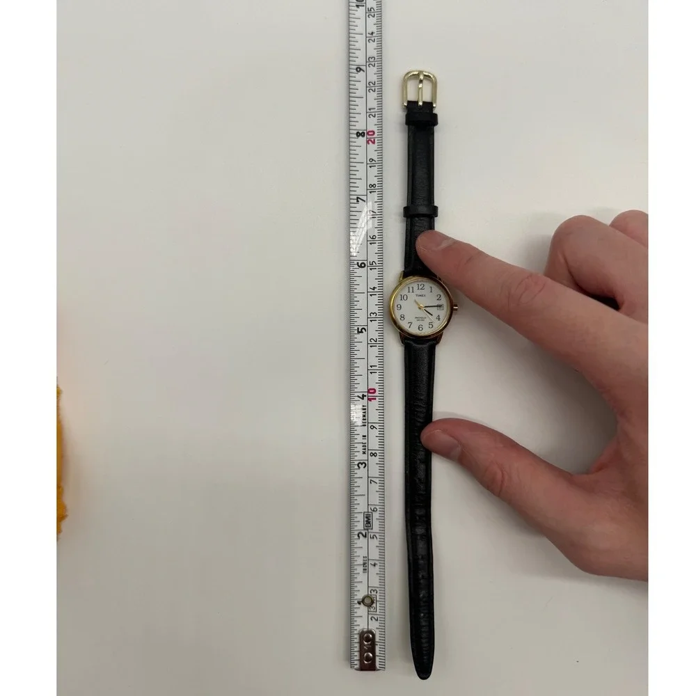 Timex Indiglo WR 30M Gold Tone White Dial Black Leather Watch CR 1216 needs bat